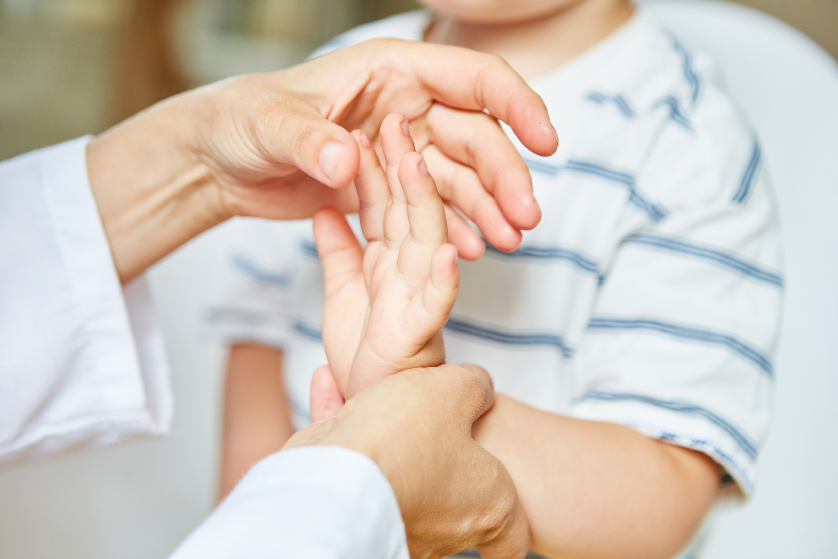 Osteopath Treats Child's Hand with Sprain